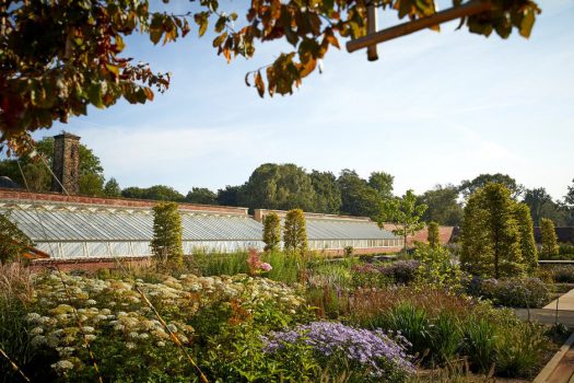 View towards the Glasshouses in the Paradise Garden at RHS Garden Bridgewater © RHS/Photographer Mark Waugh