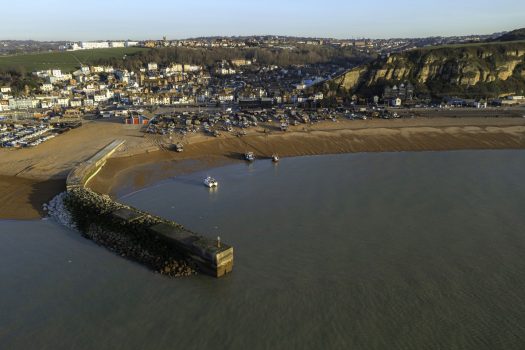 Hastings, East Sussex - Hastings Old Town and fishing beach, with Country Park on the cliff tops