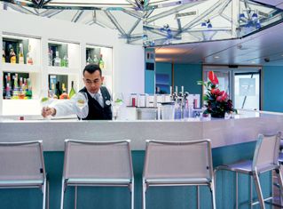 Waiter serving drinks in the Marquee Bar on Balmoral