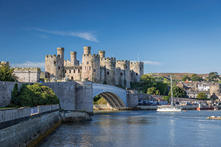 View of Conwy Castle behind the bridge, across the river
