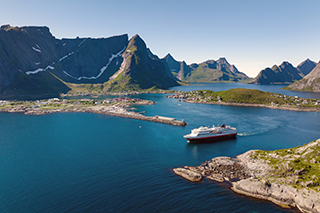 Aerial of MS Finnmarken sailing in Reine, Lofoten