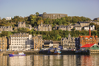 HOMEPAGE PIC - Oban, Scotland - McCaig's Tower rising above Oban town centre ©VisitScotland, Kenny Lam - - (194909) EXPIRES 06.01.2029