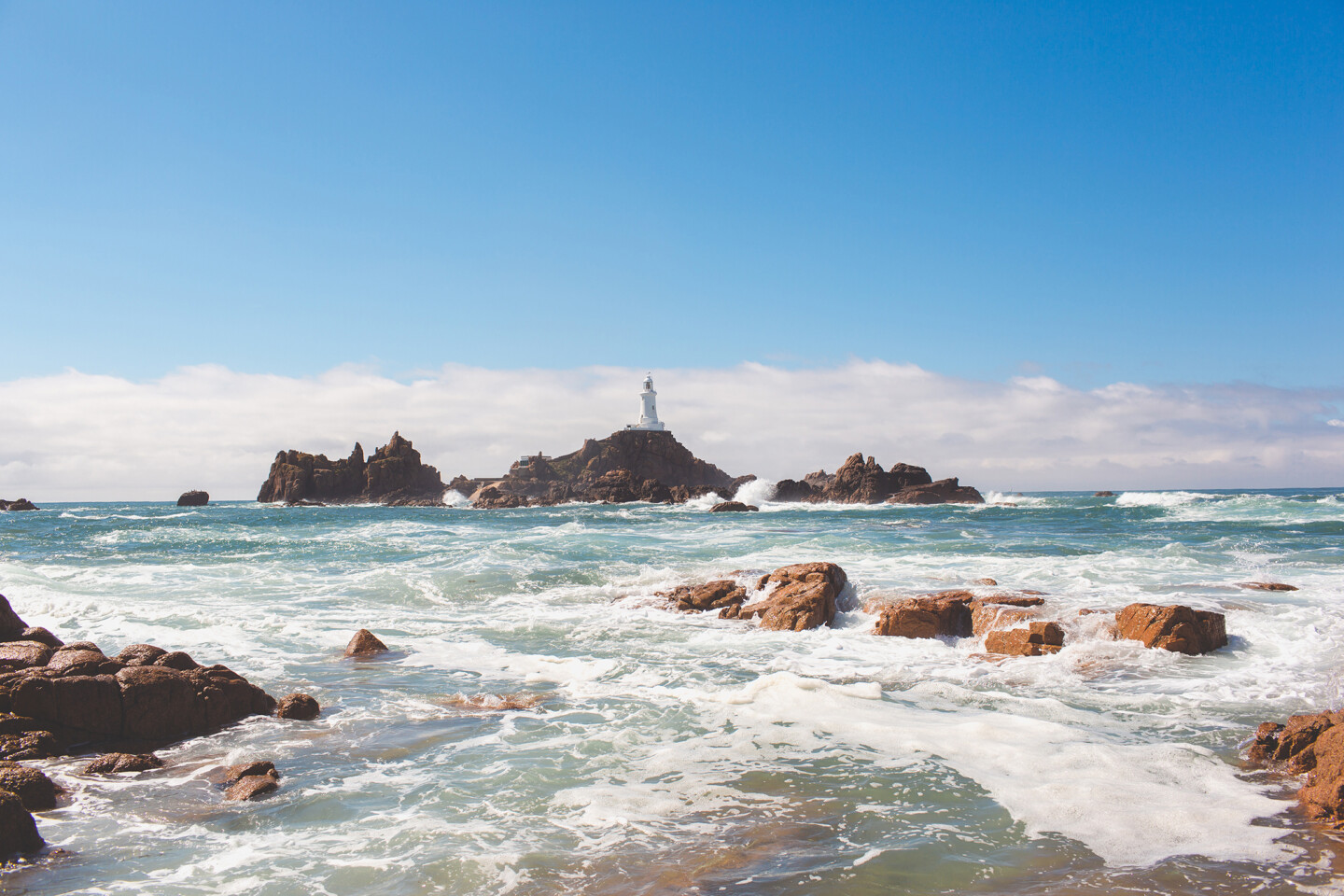 La Corbiere on a sunny day with a choppy high tide