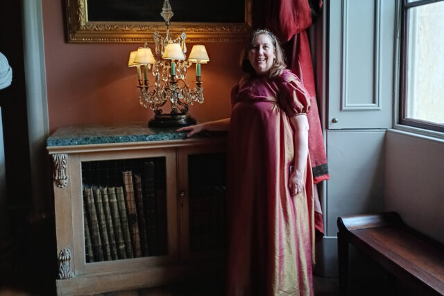 Lady Claire in costume in the Long Gallery at Castle Howard