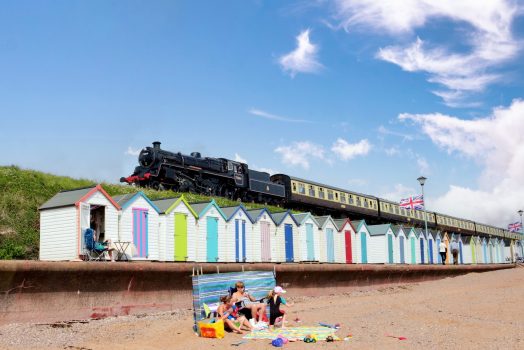 Dartmouth Steam Railway, Devon - Braveheart above Goodrington beach huts