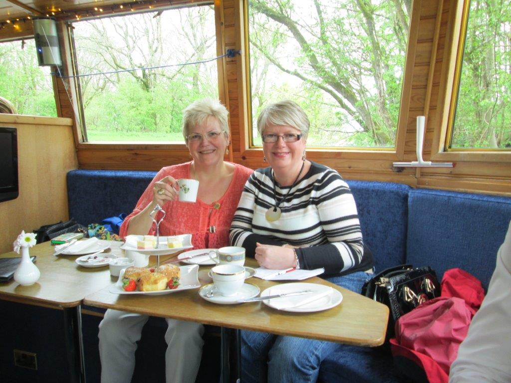 Gina (L) and Jenny (R) enjoying afternoon tea on a canal cruise