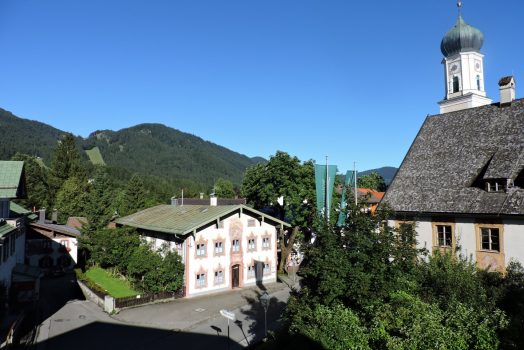 Germany Oberammergau small estate and hills in the background. Photo taken on a FAM trip to Germany