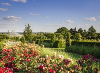 RHS Garden Hyde Hall, Chelmsford, Essex - The Rose Garden and Glasshouse in the Global Growth Vegetable Garden © RHS, Jason Ingram