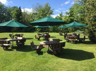 The Cairn Hotel Back Lawn with Brollies Up