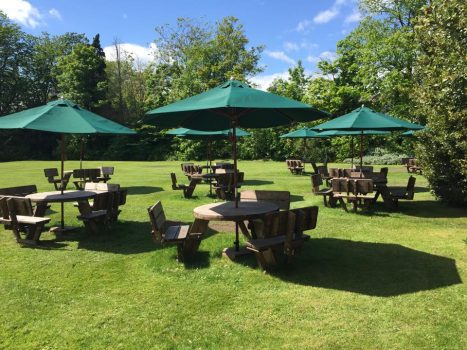 The Cairn Hotel Back Lawn with Brollies Up